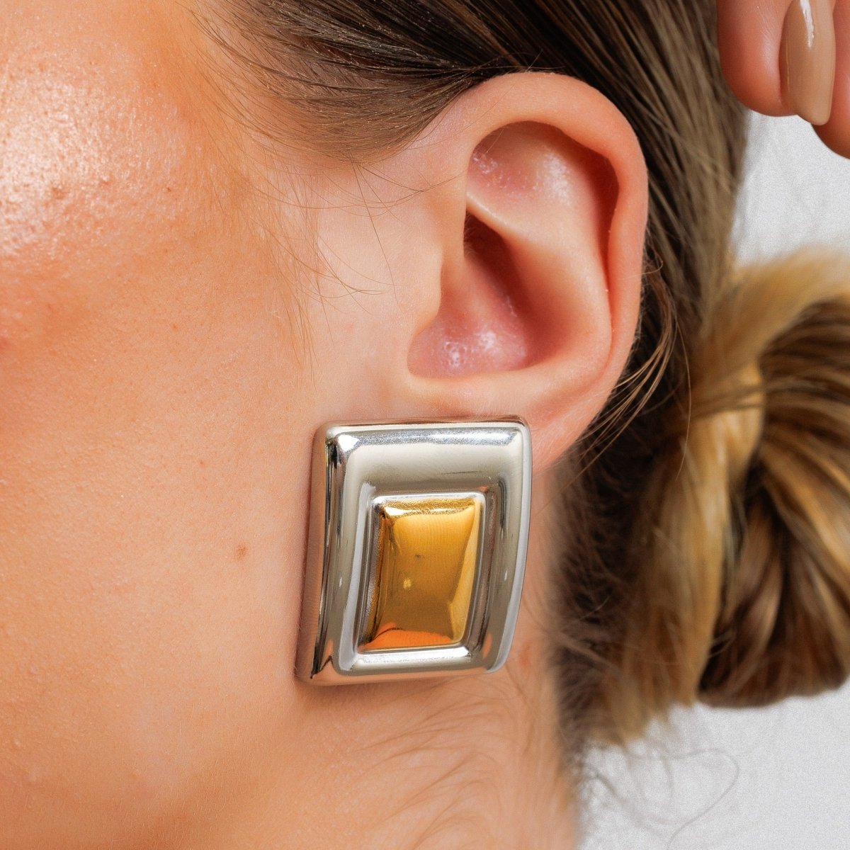Geometric earring with a mix of gold and silver plating.